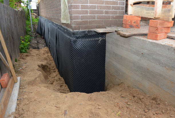 Happy homeowners after waterproofing job in Elsie